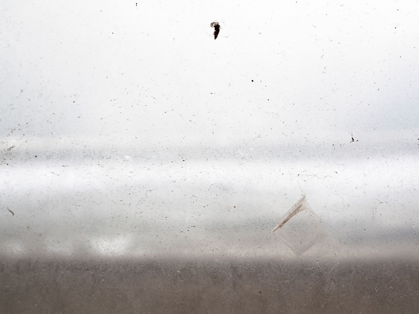 Glass window in seaside shelter, Redcar