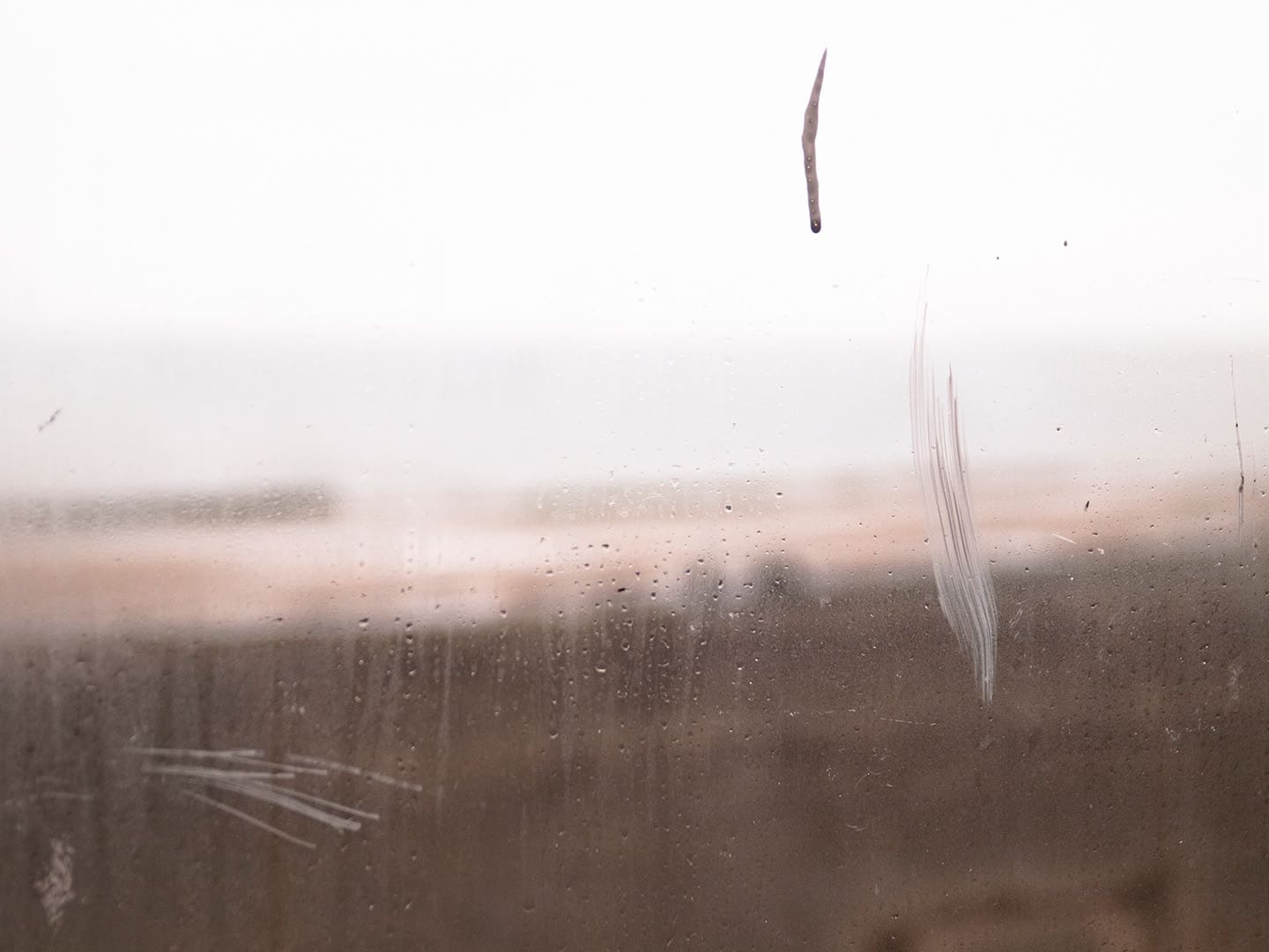 Glass window in seaside shelter, Redcar